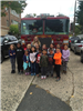 Children and Teacher in Front of Fire Truck